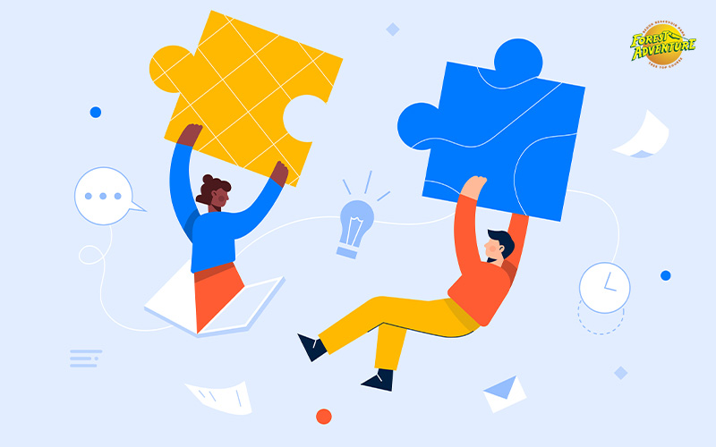An illustration of two people fitting puzzle pieces together.